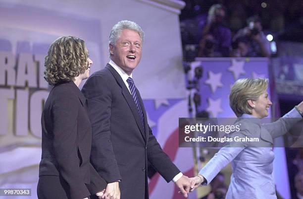 President Bill Clinton and his family at the end of his speech at the Staples Center during the DNC National Convention in Los Angeles California.