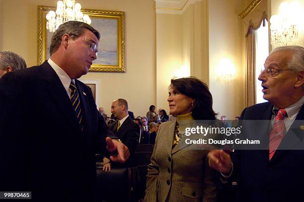 Gov. Jeb Bush, R-Fla. Talks with Katherine Harris, R-Fl. And Bill Pascrell, D-NJ. Before the start of the House Homeland Security Committee...