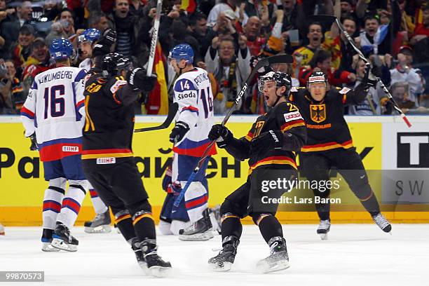 Alexander Barta of Germany celebrates with his team mates after scoring his team's first goal during the IIHF World Championship qualification round...