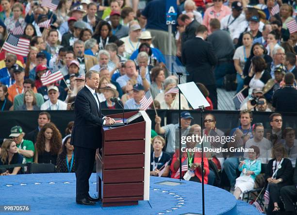 Former U.S. Vice President Al Gore greets the crowd before giving his speech on day four of the Democratic National Convention at Invesco Field at...