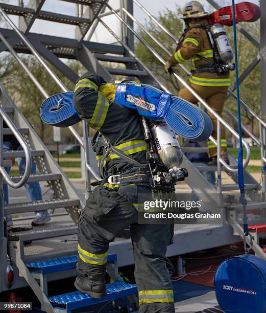 Firefighters start the tower climb during the Firefighter Combat Challenge. The event attracts hundreds of U.S. And Canadian municipal fire...