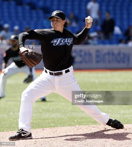 Scott Downs of the Toronto Blue Jays pitches against the Texas Rangers during a MLB game at the Rogers Centre on May 16, 2010 in Toronto, Ontario,...