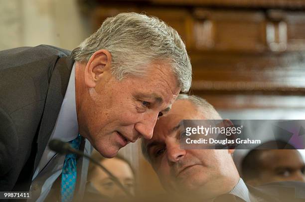 Chuck Hagel, R-Ne., and Jack Reed, D-RI., talk during the Senate Banking, Housing and Urban Affairs Committee, full committee hearing on the Federal...