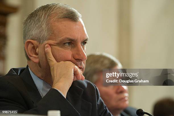 Jack Reed, D-RI., listens to Federal Reserve Board Chairman Ben Bernanke as he testified before the Senate Banking, Housing and Urban Affairs...