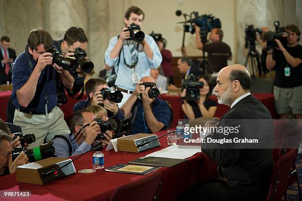 Photographers swarm Federal Reserve Board Chairman Ben Bernanke at the Senate Banking, Housing and Urban Affairs Committee Full committee hearing on...