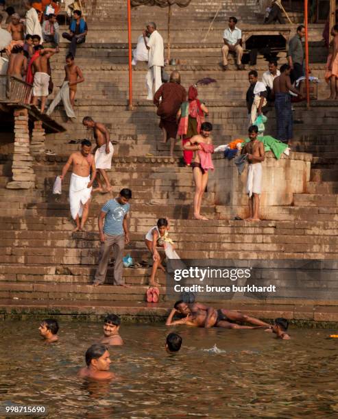 a view of the ghats of varanasi india from the ganges river. - bathing ghat fotografías e imágenes de stock