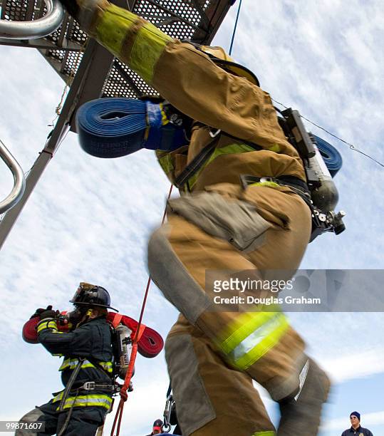 Firefighters start the tower climb during the Firefighter Combat Challenge. The event attracts hundreds of U.S. And Canadian municipal fire...