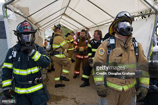 Firefighters wait their turn during the Firefighter Combat Challenge. The event attracts hundreds of U.S. And Canadian municipal fire departments...