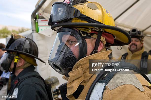 Firefighters wait their turn during the Firefighter Combat Challenge. The event attracts hundreds of U.S. And Canadian municipal fire departments...