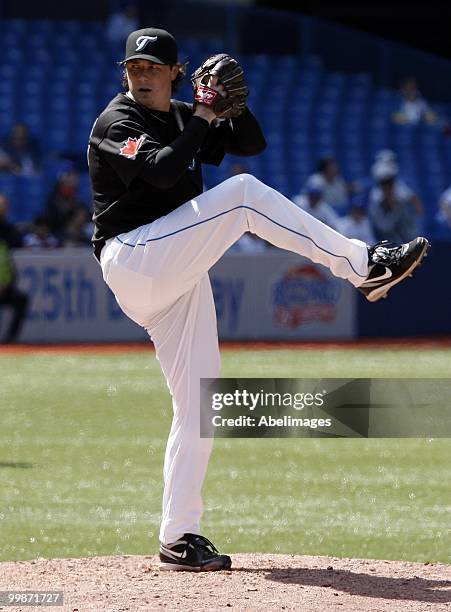 Scott Downs of the Toronto Blue Jays pitches against the Texas Rangers during a MLB game at the Rogers Centre on May 16, 2010 in Toronto, Ontario,...