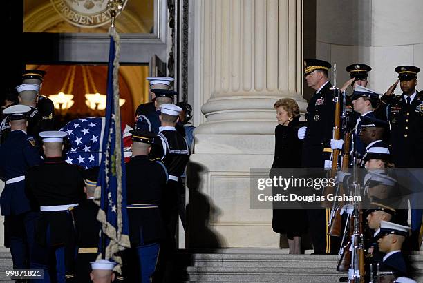 Former first lady Betty Ford waits at the top of the steps to the U.S. House of Representatives waiting to escort the remains of her husband, former...