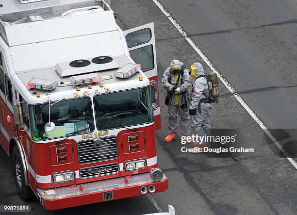 Two members of the haz-mat team prepare to check a suspicious package at the U.S. Postal Museum on North Capitol Street in Washington, D.C. March 3,...