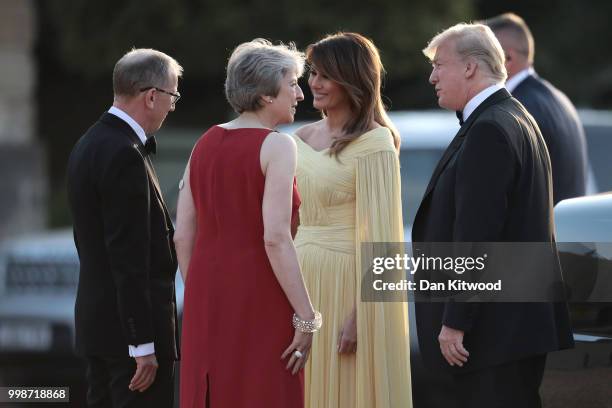 Britain's Prime Minister Theresa May and her husband Philip May greet U.S. President Donald Trump, First Lady Melania Trump at Blenheim Palace on...