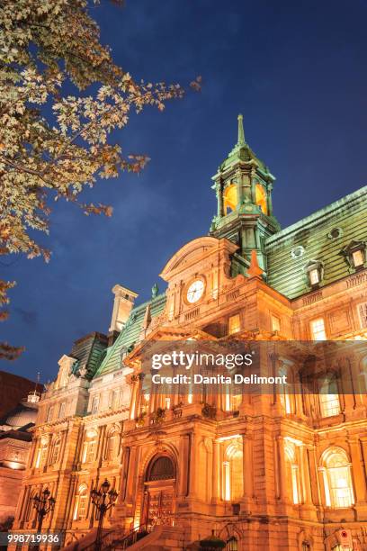 low angle view of hotel de ville, vieux-montreal, quebec, canada - vieux stockfoto's en -beelden