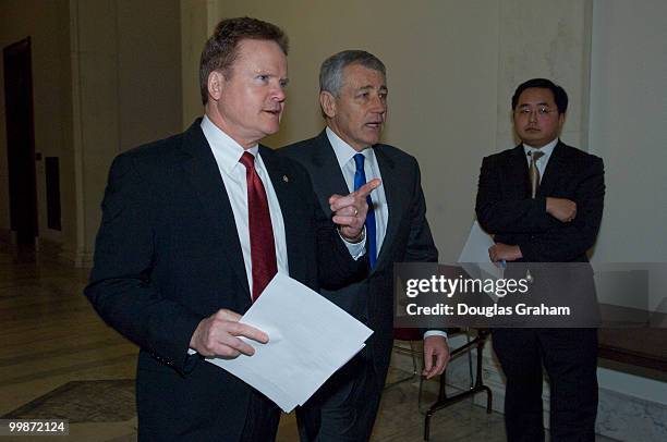 Jim Webb, D-Va. And Chuck Hagel, R-Neb., walk to a news conference to discuss the independent budget of leading veterans' organizations, including...