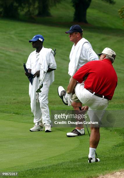 Joe Baca, D-CA., barley misses a long putt during the First Tee Congressional Challenge golf tournament at Columbia Country Club in Chevy Chase,...