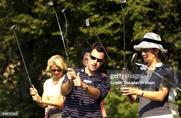 Ben Zatz the asst. Golf pro helps a small grop of female lobbyist with their putting skills. The Women's Networking Forum' was learning how to play...