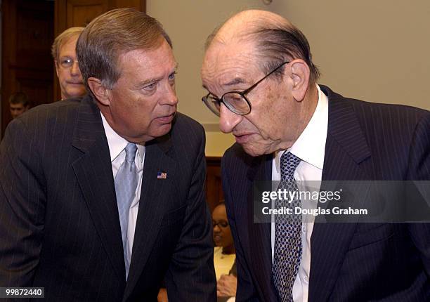 Chairman Mike Oxley, R-OH., and Federal Reserve Chairman Alan Greenspan talk before the start of the hearing on the monetary policy report full...