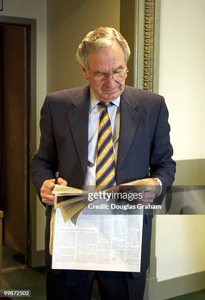 Tom Harkin, D-IA., reads the paper before the start of a press conference on the economy and gun liability.