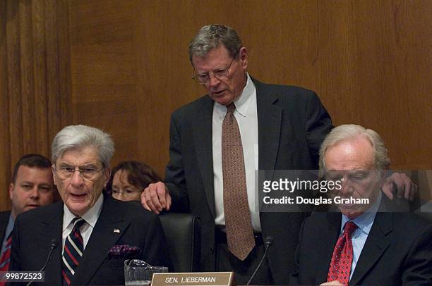 John Warner, R-VA., James Inhofe, R-OK., and Chairman Joseph Lieberman, I-CT., talk before the start of the Private Sector and Consumer Solutions to...