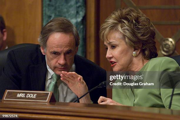 Chairman Thomas Carper, D-DE., and Elizabeth Dole, R-NC., talk during a full committee hearing on "Shopping Smart and Avoiding Scams: Financial...