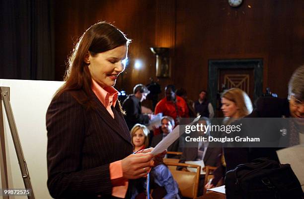 Geena Davis Oscar-winning actress goes over her speech before the start of the news conference to urge protection of athletic opportunities for...