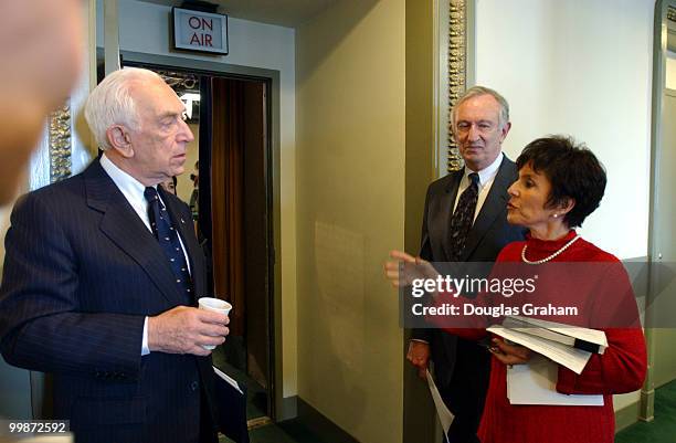 Frank Lautenberg, D-N.J., James Jeffords, I-Vt. And Barbara Boxer, D-Calif., talk before the start of the news conference to question Bush...