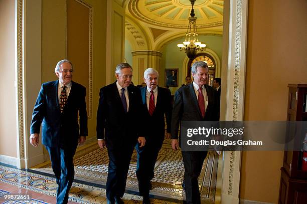 Tom Harkin, D-IA., Senate Majority Leader Harry Reid, D-NV., Chris Dodd, D-CT., and Max Baucus, D-MT., head to a press conference in the U.S. Capitol...