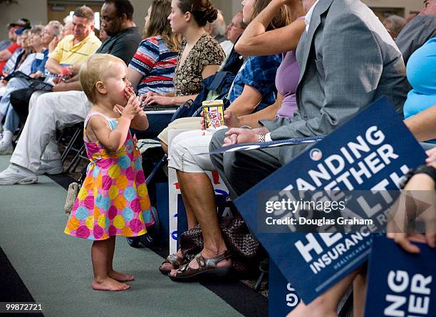 Emily Johnson age 2 enjoys a little light lunch during the 3 hour long town hall meeting on health care hosted by Rick Boucher, D-VA., at the...