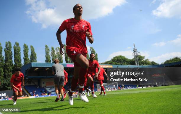 Joel Matip of Liverpool warms up before the pre-season friendly match between Bury and Liverpool at Gigg Lane on July 14, 2018 in Bury, England.