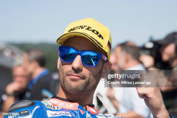 Mattia Pasini of Italy and Italtrans Racing celebrates the pole position at the end of the qualifying practice during the MotoGp of Germany -...