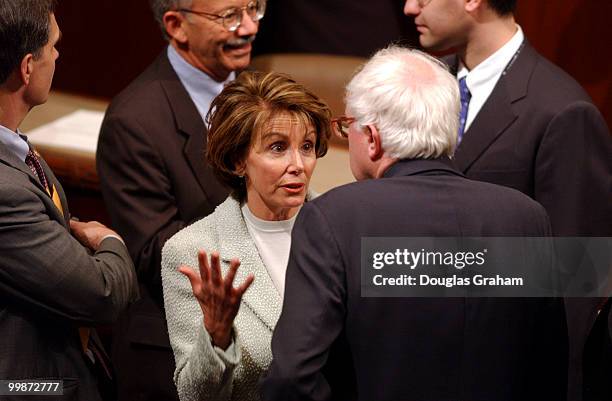 Nancy Pelosi, D-CA., talks with Bernard Sanders, I-VT., during the opening session of the 108th Congress.