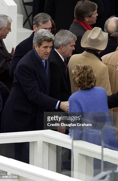 John Kerry and Elizabeth Dole greet each other during President George W. Bush's Inauguration.