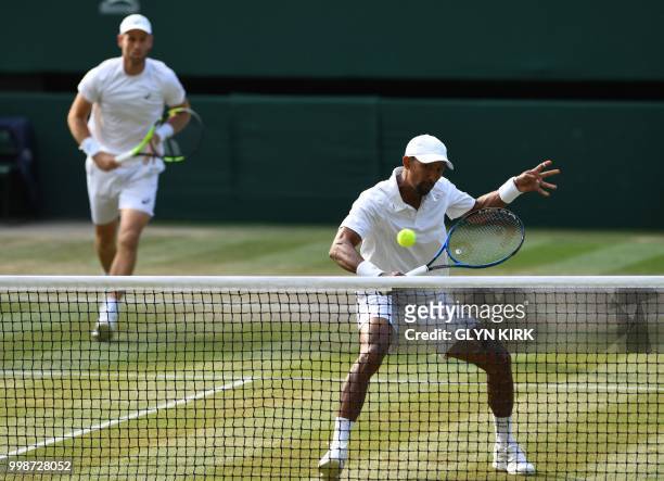 South Africa's Raven Klaasen and New Zealand's Michael Venus return to US player Mike Bryan and US player Jack Sock during their mens' doubles final...