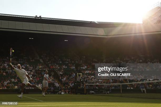 South Africa's Raven Klaasen and New Zealand's Michael Venus return to US player Mike Bryan and US player Jack Sock during their mens' doubles final...