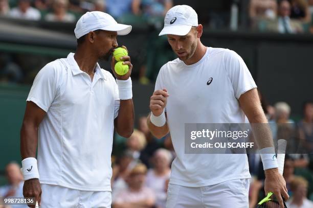 South Africa's Raven Klaasen and New Zealand's Michael Venus play US player Mike Bryan and US player Jack Sock during their mens' doubles final match...