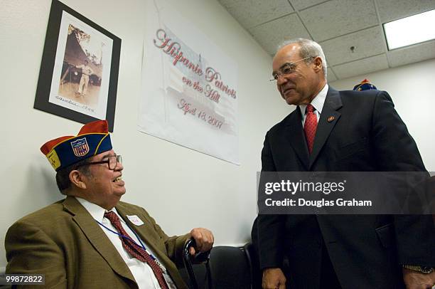 Louis Tellez a WWII vet talks with Joe Baca, D-CA., during a press conference for the Hispanic Patriots Day on the Hill.