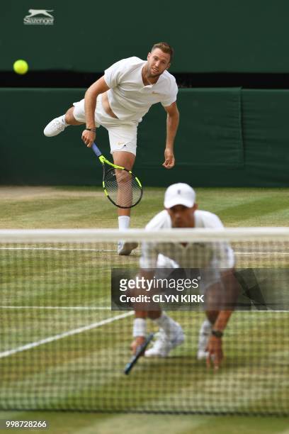 Player Mike Bryan and US player Jack Sock serve to South Africa's Raven Klaasen and New Zealand's Michael Venus during their mens' doubles final...