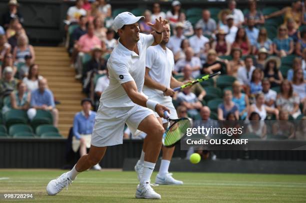 Player Mike Bryan and US player Jack Sock return to South Africa's Raven Klaasen and New Zealand's Michael Venus during their mens' doubles final...