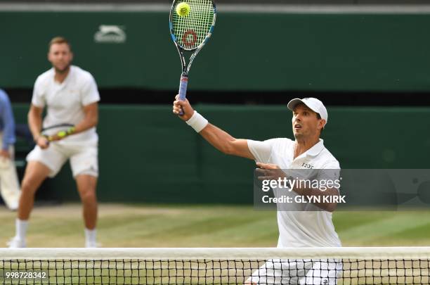 Player Mike Bryan and US player Jack Sock return to South Africa's Raven Klaasen and New Zealand's Michael Venus during their mens' doubles final...