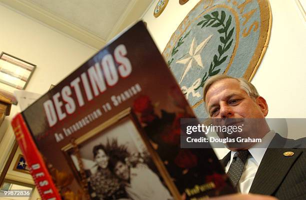 Gene Green, D-TX., reads through his "Destinos" text book for a spanish class he is taking.