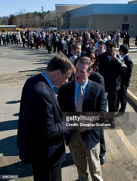 Mark Warner, D-VA., works the line of over 4000 attendees of the federal job fair at the University of Mary Washington's Stafford Campus. The job...