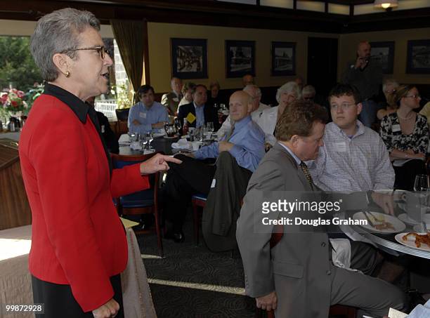Judy Feder addresses the crowd as Jim Webb a Virginia U.S. Senate candidate listens during a breakfast at the Dulles Area Democrat's meeting in...