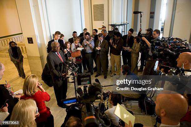 House Majority Whip James E. Clyburn, D-S.C., talks with reporters as he leaves the Democratic Caucus in the Cannon House Office Building. March 19,...