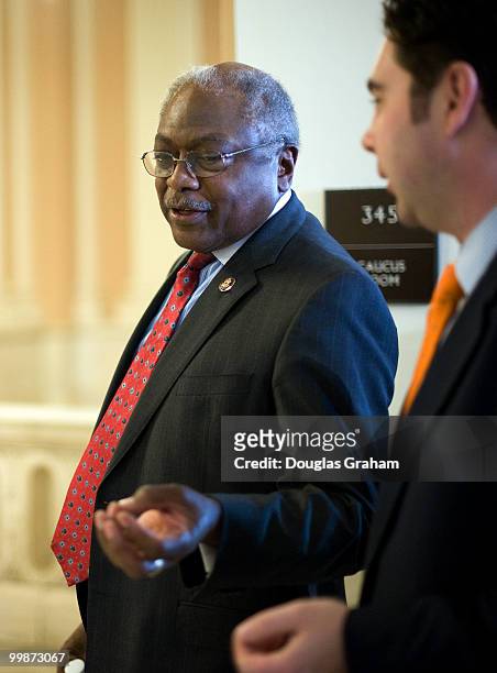 House Majority Whip James E. Clyburn, D-S.C., talks with reporters as he leaves the Democratic Caucus in the Cannon House Office Building. March 19,...