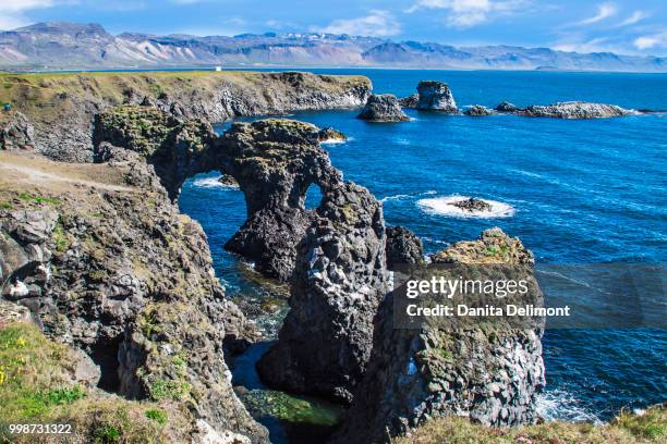 rock formations of west coast, arnarstapi, snaefellsjokull, snaefellsnes peninsula, iceland - arnarstapi stockfoto's en -beelden