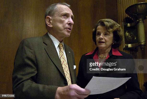 Chairman Arlen Specter , R-PA. Talks with Dianne Feinstein before the start of the Senate Judiciary Committee on Immigration Reform.
