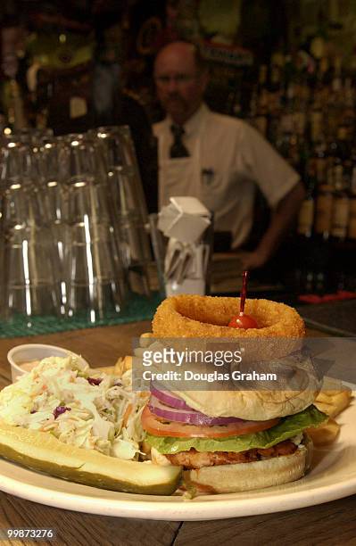 Kevin Malleck a "bar keep" at Kelly's Irish Times keeps an eye on the new sandwich the bar has introduced to its menu called the "Roll Caller"