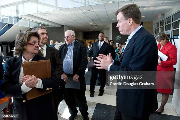 Mark Warner, D-VA., works the line of over 4000 attendees of the federal job fair at the University of Mary Washington's Stafford Campus. The job...