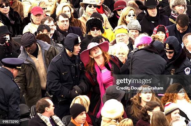 Protester is pulled from the ticketed seating area on the West Front of the U.S. Capitol as President George W. Bush is sworn in for his second term...